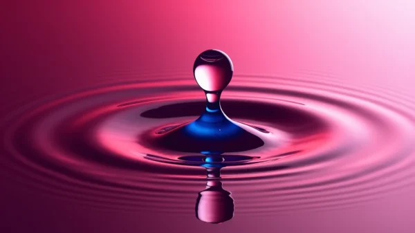 Imagen conceptual y minimalista que representa la SexTech como la fusión de la ciencia y el placer. Muestra un objeto tecnológico (simulando un vibrador con app o un juguete de presión) interactuando con una superficie fluida en tonos magenta y azul, simbolizando el biofeedback y la innovación en la ciencia del placer y el bienestar digital.